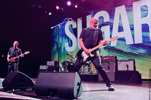 Bob Mould playing guitar and David Barbe playing bass